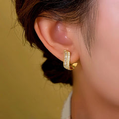 Angled view of the 14K Gold-plated Zircon Bead Tassel Earrings