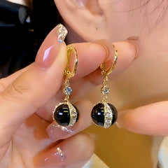 Close-up detail of the sparkling zircons and plating on the Black Pearl Earrings