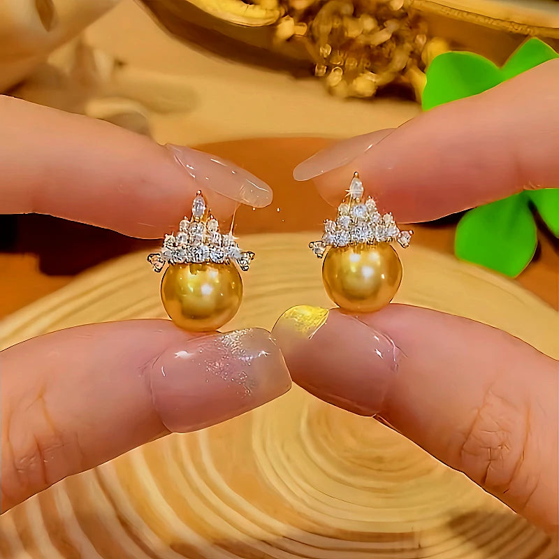 Close-up detail of the sparkling zircons and plating on the Crown Stud Earrings
