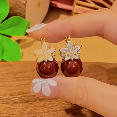 Close-up detail of the sparkling zircons and plating on the Flower Pearl Earrings