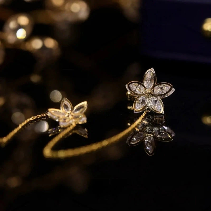 Close-up detail of the sparkling zircons and plating on the Golden Flower Ear Cuff