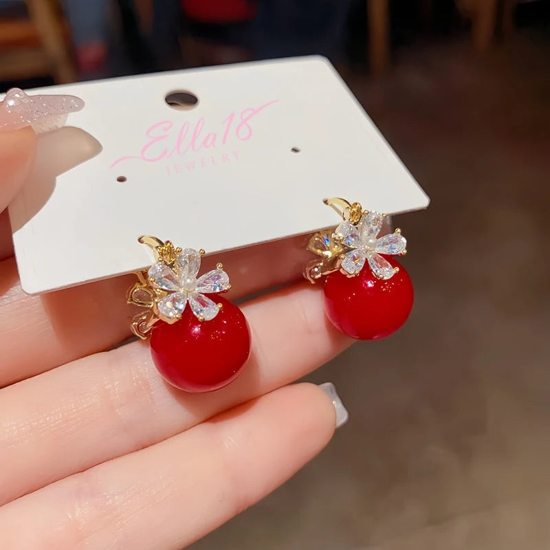 Angled view of the 14K Gold-plated Zircon Flower Pearl Earrings