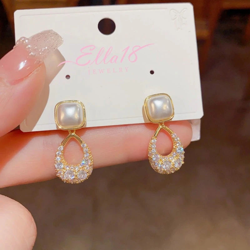 Angled view of the 14K Gold-plated Zircon Geometric Pearl Earrings