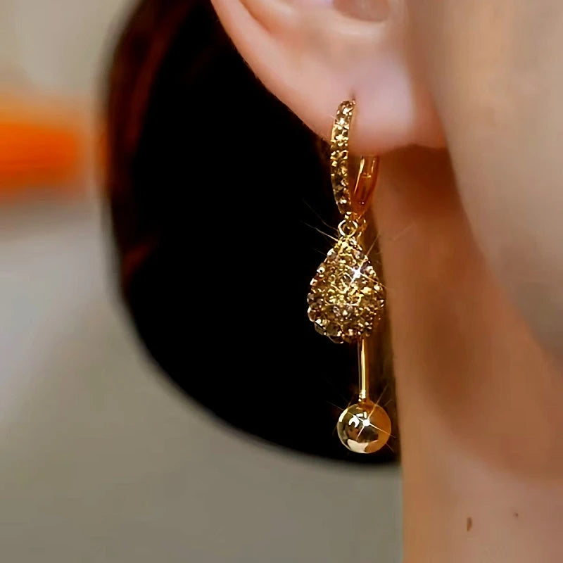 Close-up detail of the sparkling zircons and plating on the Water Drop Earrings