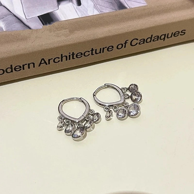 Close-up detail of the sparkling zircons and plating on the Tassel Earrings