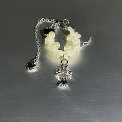 Close-up view of the gemstone and setting of the Gold Cross Ring