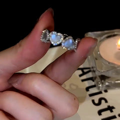 Close-up view of the gemstone and setting of the Gold Heart Ring
