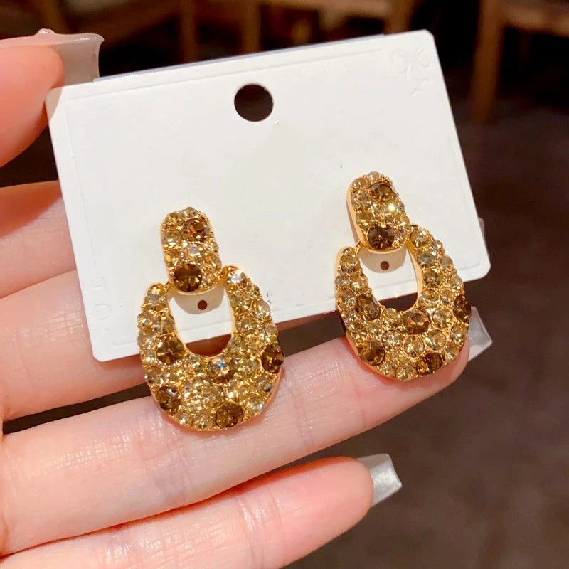 Angled view of the 14K Gold Plated Brown Diamond Earrings