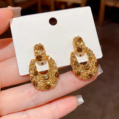 Angled view of the 14K Gold Plated Brown Diamond Earrings