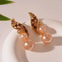 Angled view of the 14K Gold Plated Brown Diamond Pearl Earrings