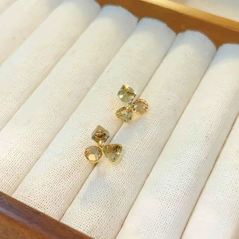 Angled view of the 14K Gold Plated Champagne Diamond Flower Stud Earrings