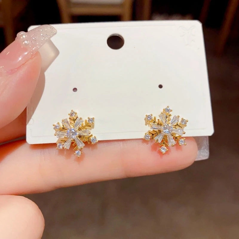 Close-up detail of the sparkling zircons and plating on the snowflake earrings