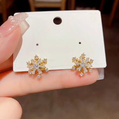 Close-up detail of the sparkling zircons and plating on the snowflake earrings