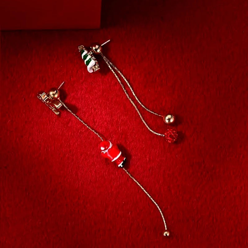 Angled view of the 14K Gold Plated Christmas Santa Claus Tassel Earrings
