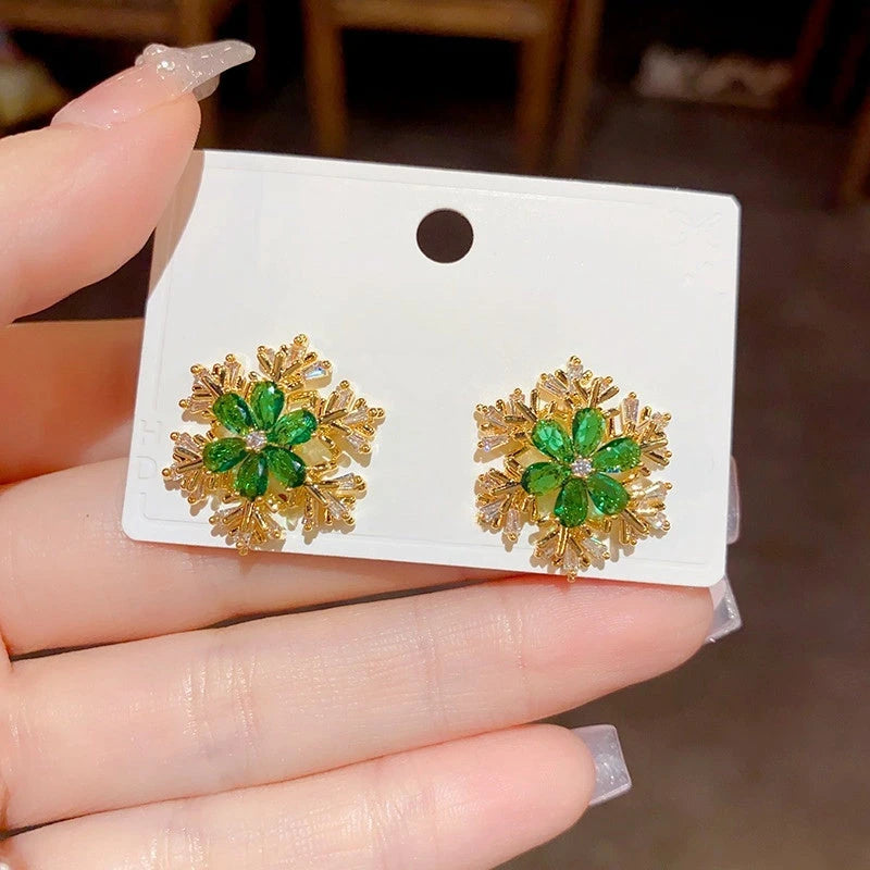 Close-up detail of the sparkling zircons and plating on the snowflake earrings