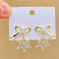 Detailed view of the sparkling accents on the christmas earrings