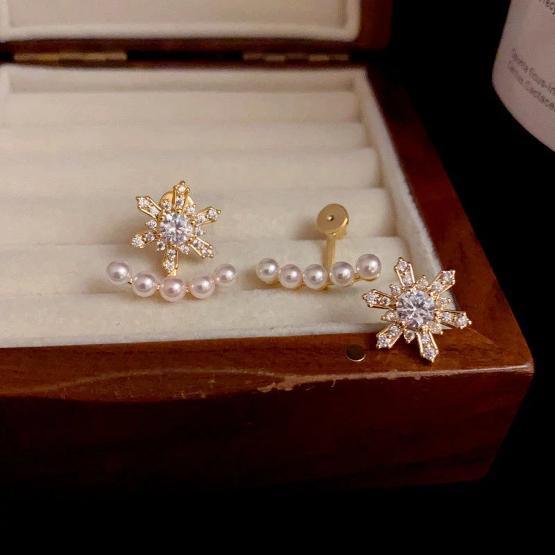 Angled view of the 14K Gold Plated Christmas Zircon Snowflake Pearl Two-Piece Earrings