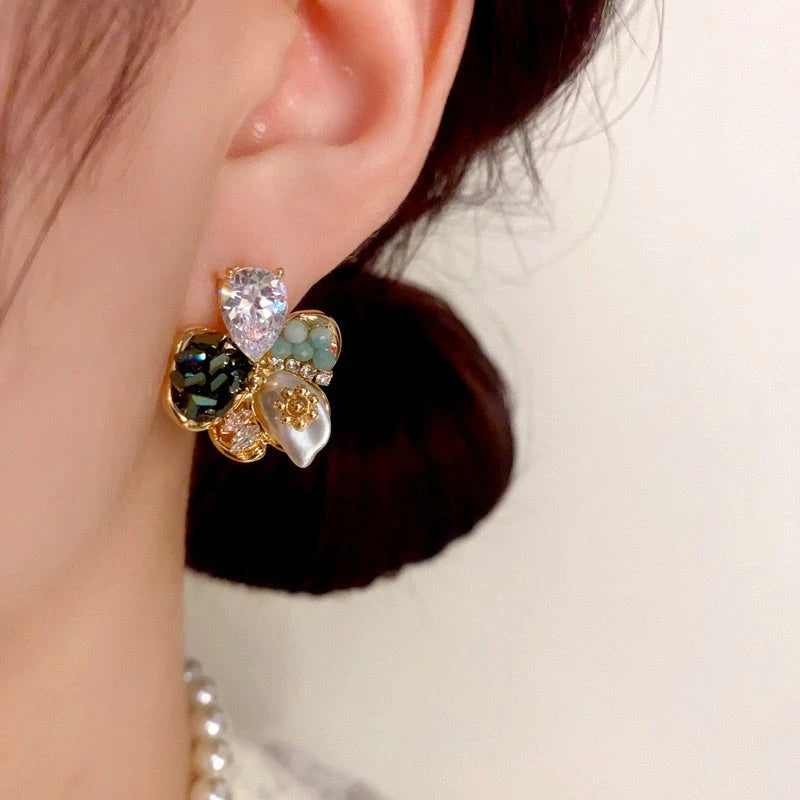 Model showcasing the dangle and style of the 14K Gold Plated Colorful Diamond Flower Earrings