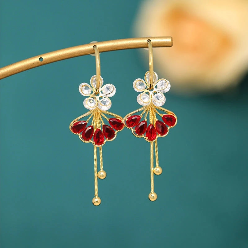 Close-up detail of the sparkling zircons and plating on the gold leaf earrings