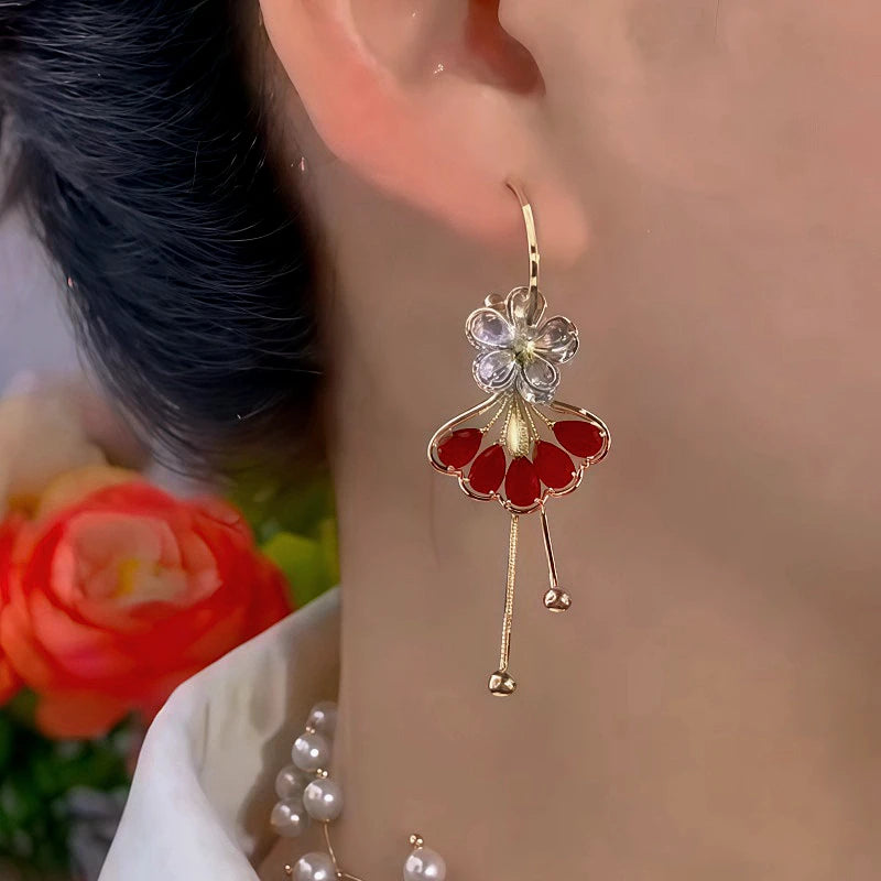 Model showcasing the dangle and style of the 14K Gold Plated Diamond-Studded Ginkgo Flower Earrings