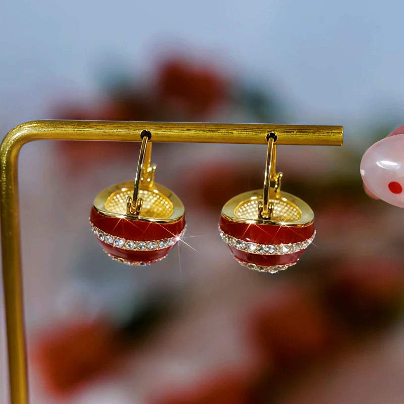 Model showcasing the dangle and style of the 14K Gold Plated Diamond Basket Earrings
