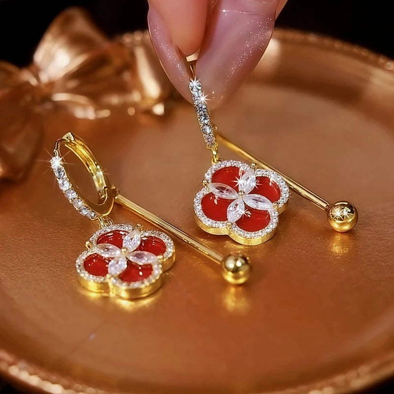 Close-up detail of the sparkling zircons and plating on the clover earrings