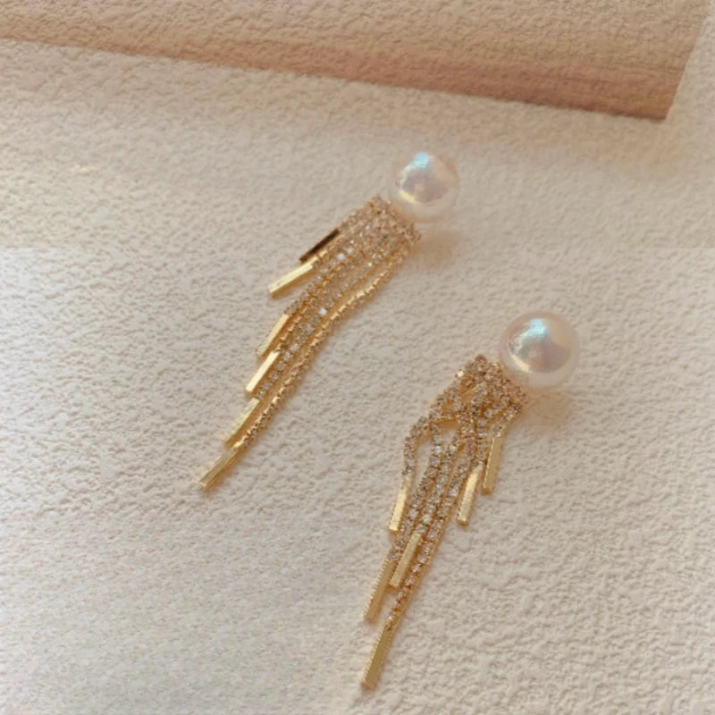 Close-up detail of the sparkling zircons and plating on the Pearl Tassel Earrings