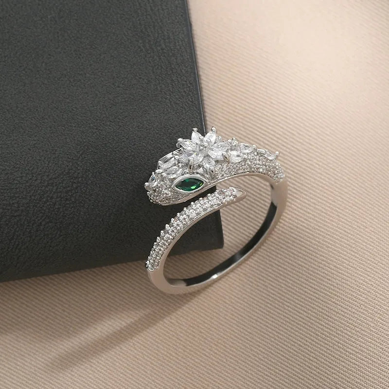 Close-up view of the gemstone and setting of the gold snake ring