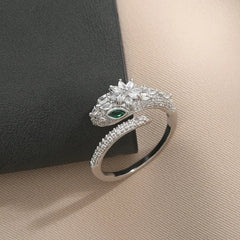 Close-up view of the gemstone and setting of the gold snake ring