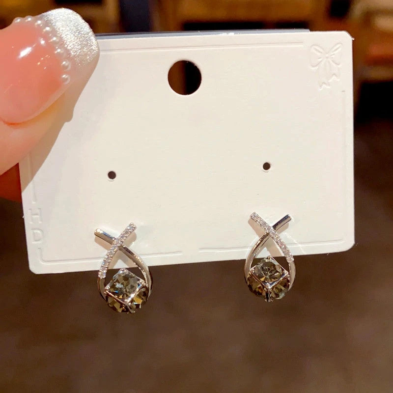 Angled view of the 14K Gold Plated Diamond Stud Earrings