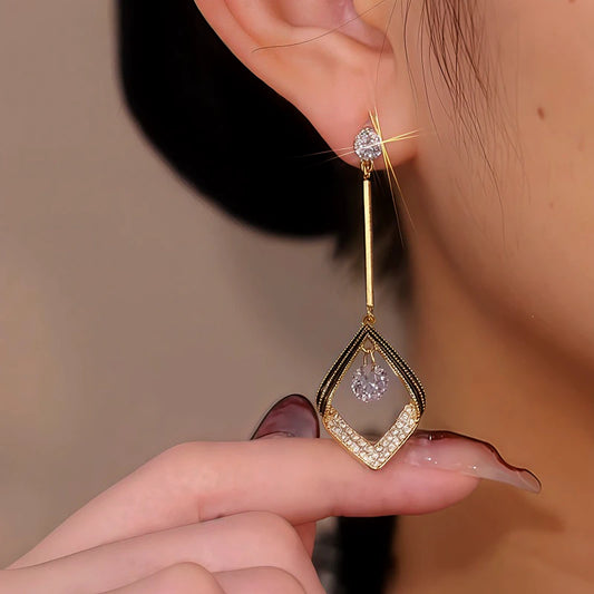 Model showcasing the dangle and style of the 14K Gold Plated Geometric Rhombus Crystal Earrings