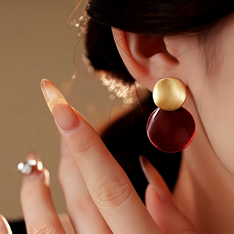 Angled view of the 14K Gold Plated Oil Drop Earrings