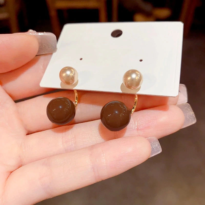 Angled view of the 14K Gold Plated Oil Drop Earrings