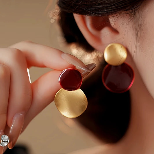 Model showcasing the dangle and style of the 14K Gold Plated Oil Drop Earrings