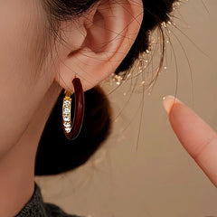 Model showcasing the dangle and style of the 14K Gold Plated Oil Drop Zircon Diamond Hoop Earrings