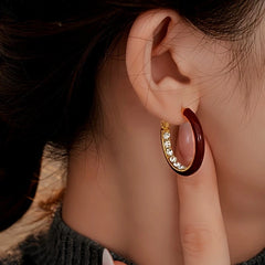 Angled view of the 14K Gold Plated Oil Drop Zircon Diamond Hoop Earrings