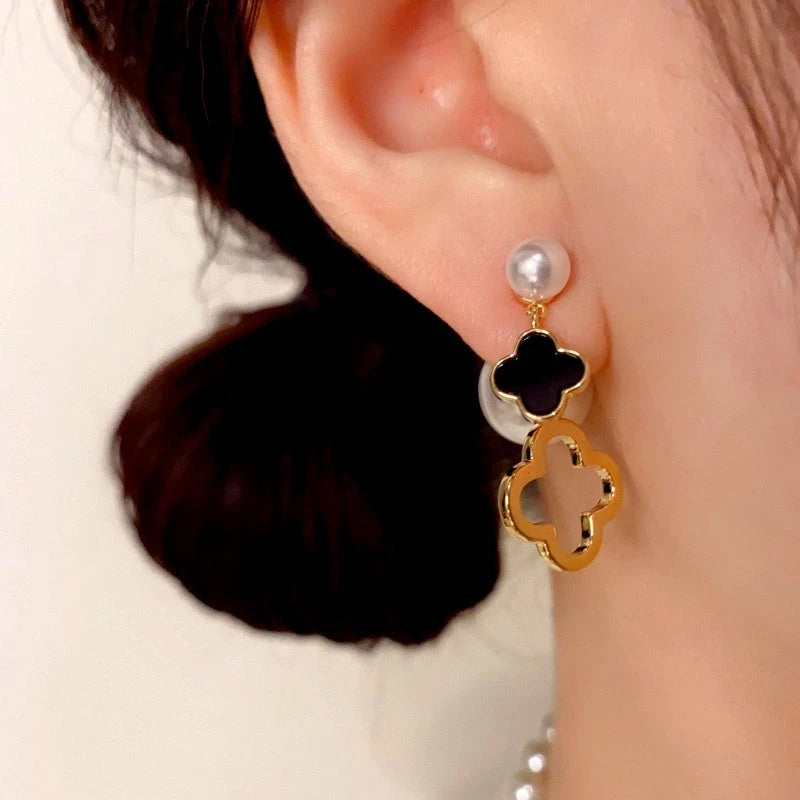 Close-up detail of the sparkling zircons and plating on the gold flower earrings