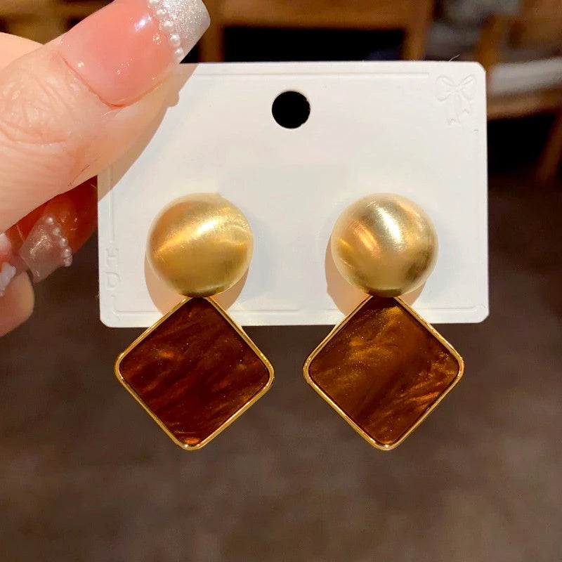 Angled view of the 14K Gold Plated Simple Square Earrings