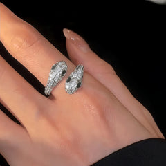 Close-up view of the gemstone and setting of the gold snake ring