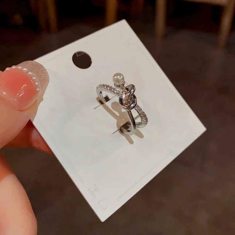 Top-down view of the sparkling Pearl & Zircon Gold Cross Ring | 14K Gold Plated