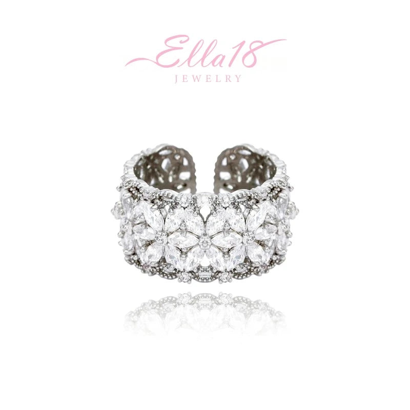 Close-up view of the gemstone and setting of the gold flower ring