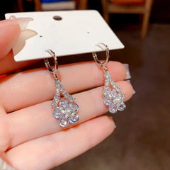 Angled view of the 14K Gold Plated Zircon Flower Earrings