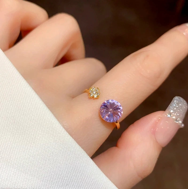 Close-up view of the gemstone and setting of the purple diamond ring