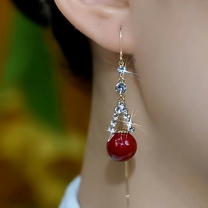 Close-up detail of the sparkling zircons and plating on the gold threader earrings