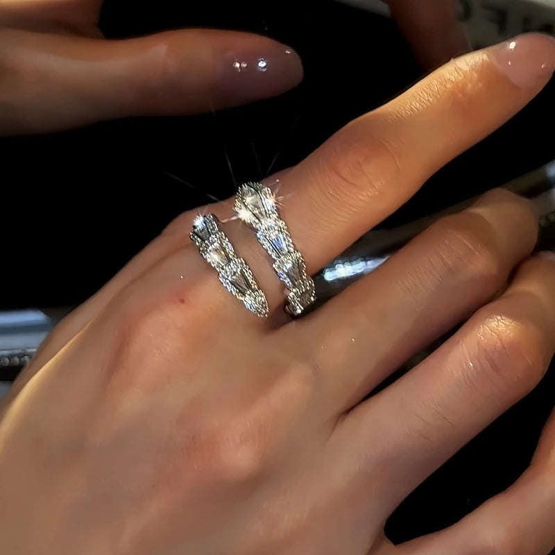Close-up view of the gemstone and setting of the gold snake ring