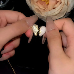 Close-up of the pendant and clasp on the Zircon Heart Necklace