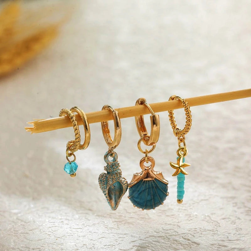 Angled view of the 14K Gold-Plated Shell Earrings Set