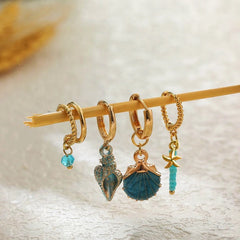 Angled view of the 14K Gold-Plated Shell Earrings Set