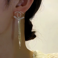 Angled view of the 14K Gold-plated Diamond Tassel Earrings