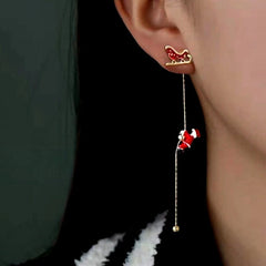 Model showcasing the dangle and style of the 14K Gold Plated Christmas Santa Claus Tassel Earrings